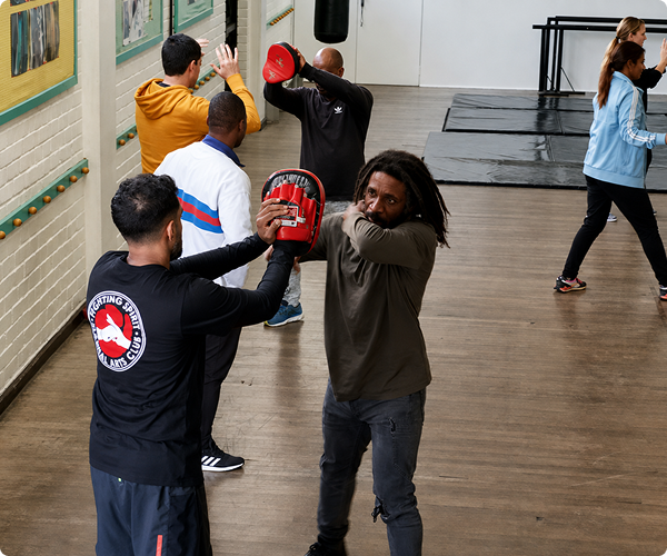 Fighting Spirit students practising self-defence pad drills